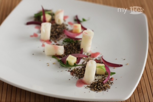 Camomile Steamed Turnip Rolls on Banana-Poppy Seed Earth with Apple, Rocket and Pomegranate Vinaigrette