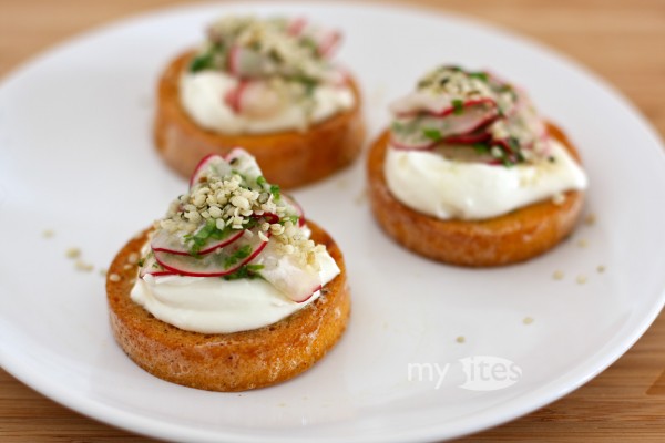 Egg Yolk "Bread" with Goat Cheese, Ramson-Marinated Radish and Hemp Seeds